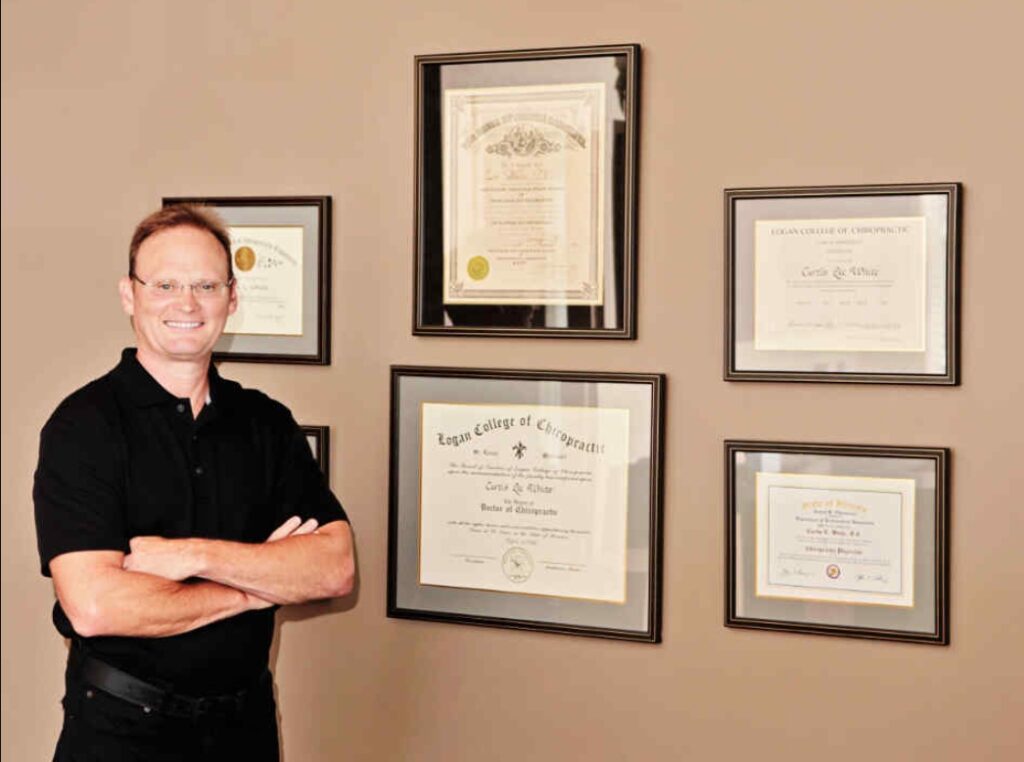 Dr. Curt White at White Chiropractic with professional diplomas in Mooresville NC