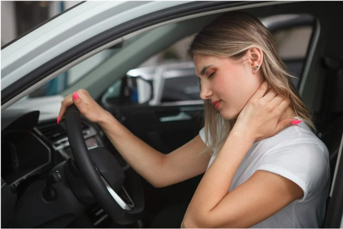Person experiencing whiplash neck pain after car accident in Lake Norman